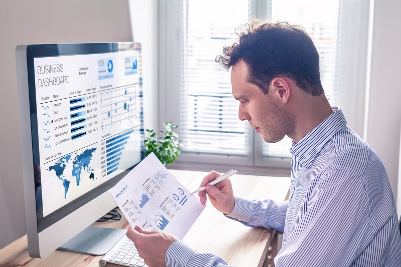 Businessman working with KPI dashboard metrics, BI graph, financial report 2
